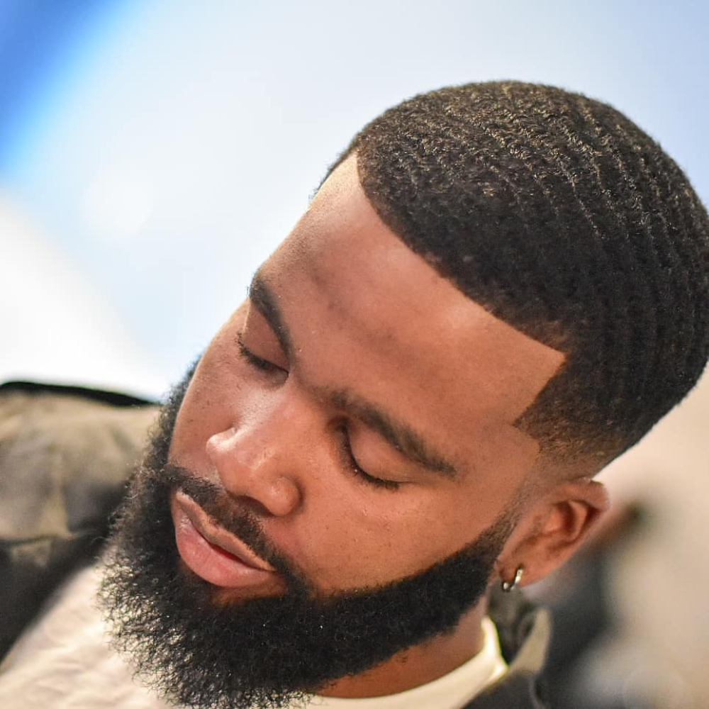 black male with waves and fresh haircut