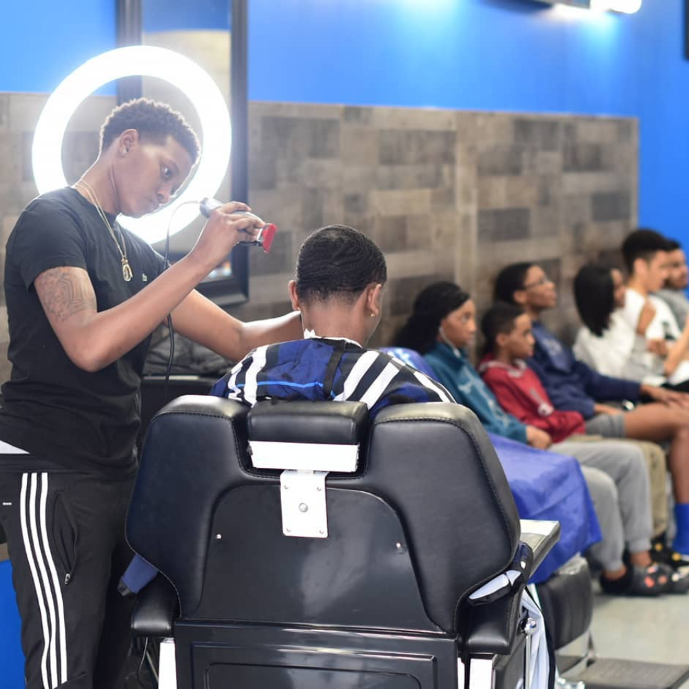 Barbershop shot of smoove cutting clients hair