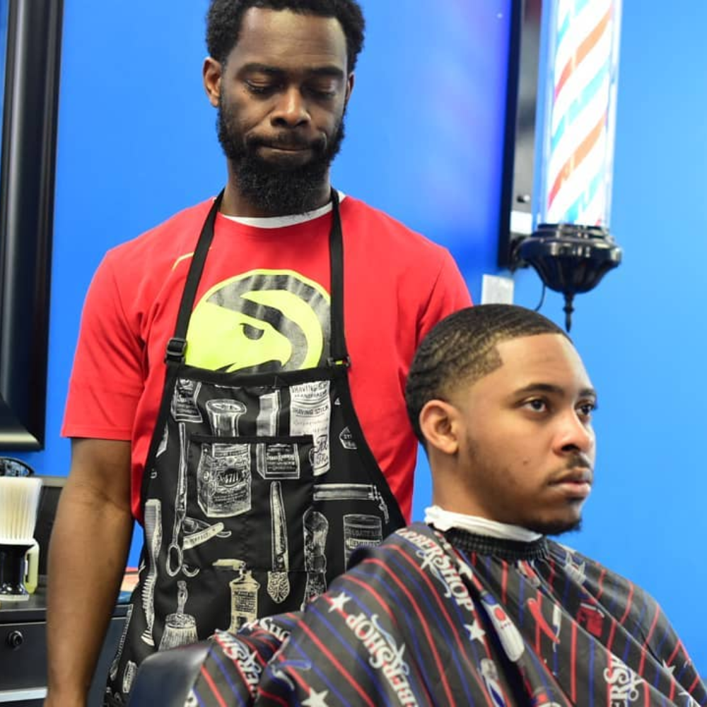 Chris the co-owner examining haircut