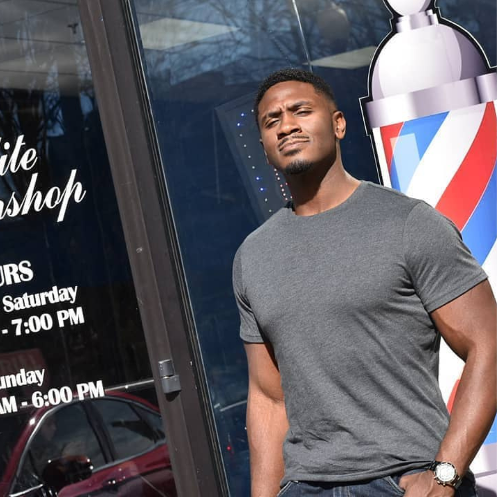 Absolute chad standing outside the barbershop after a haircut