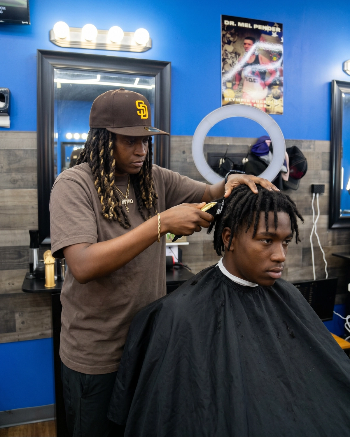 Smoove cutting hair at 2 Elite Barber Shop in Kennesaw.